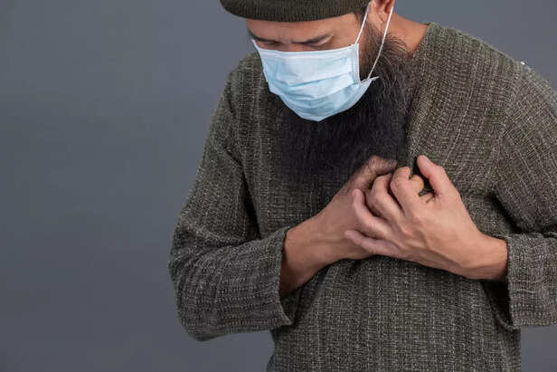 Man Holding His Chest