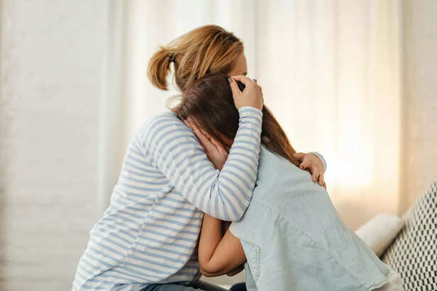 A child crying in a corne