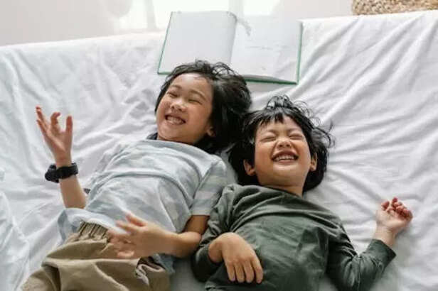 Siblings laughing togethe