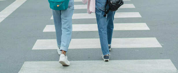 Women wearing jeans cross