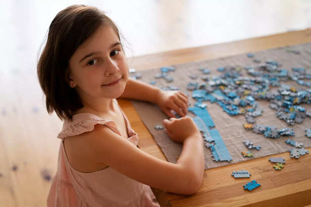Child Playing Puzzle