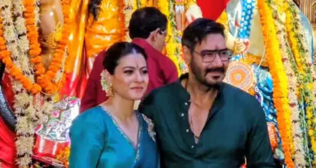 Ajay Devgn &amp; Kajol twin in green during the Maha Navmi celebration